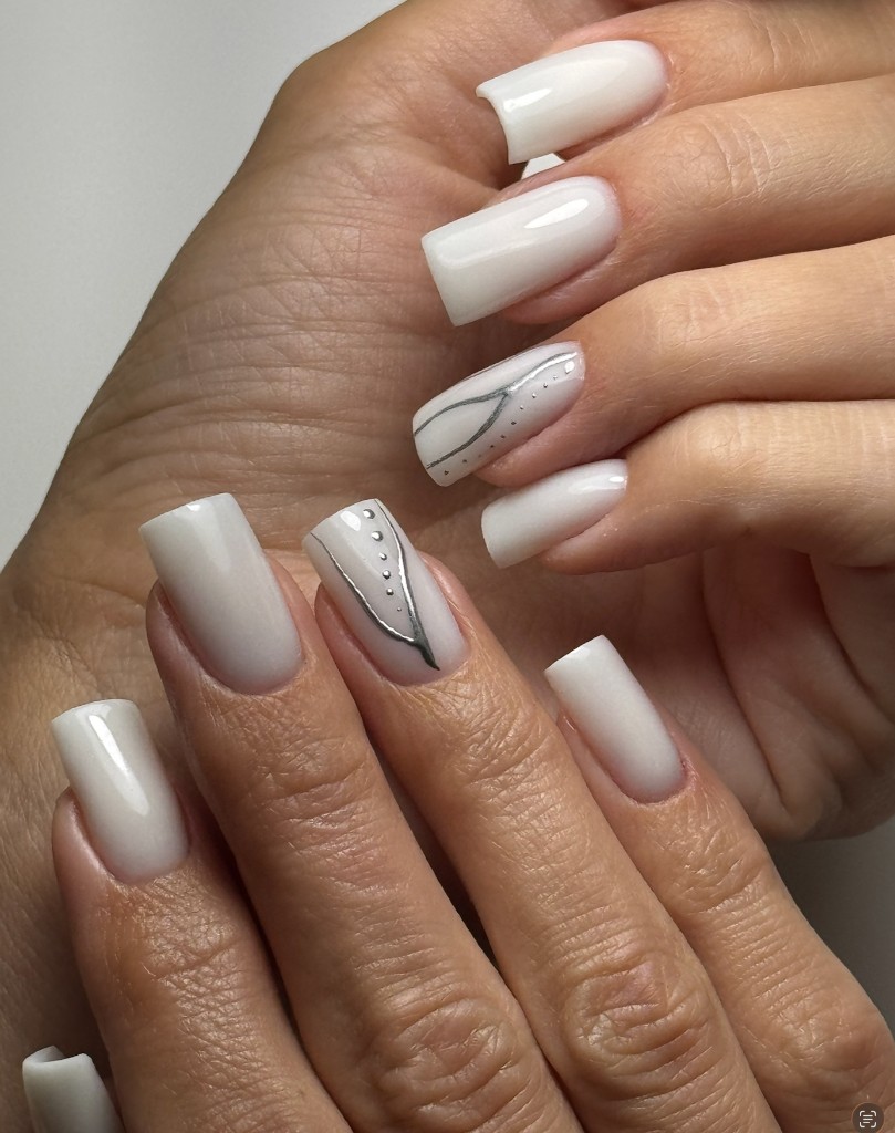 Custom cream gel manicure with silver line and dot nail art