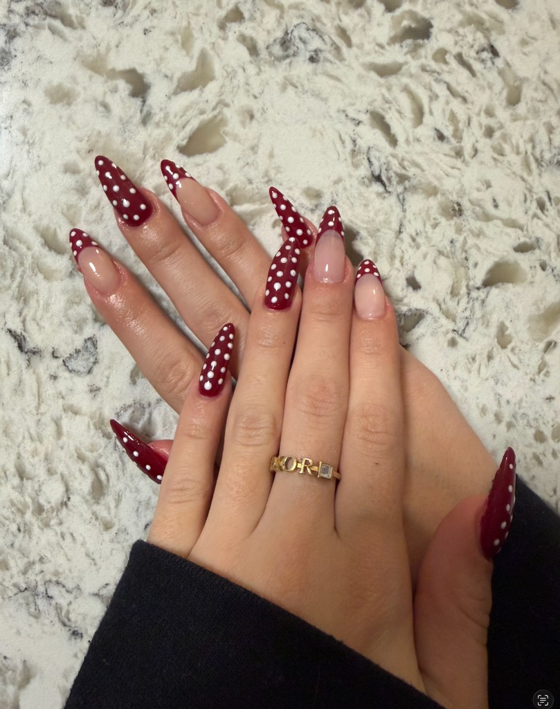 Gel X almond nails with burgundy polka dot nail art