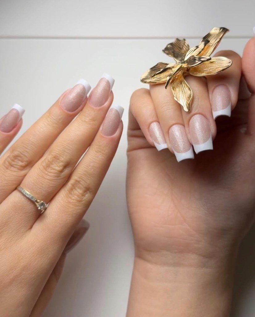 French manicure with glitter nude base and crisp white tips